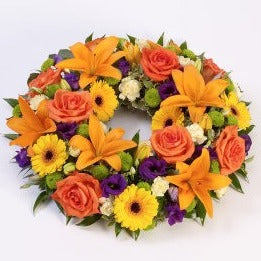 Vibrant Rose and Lily Wreath Funeral Tribute
