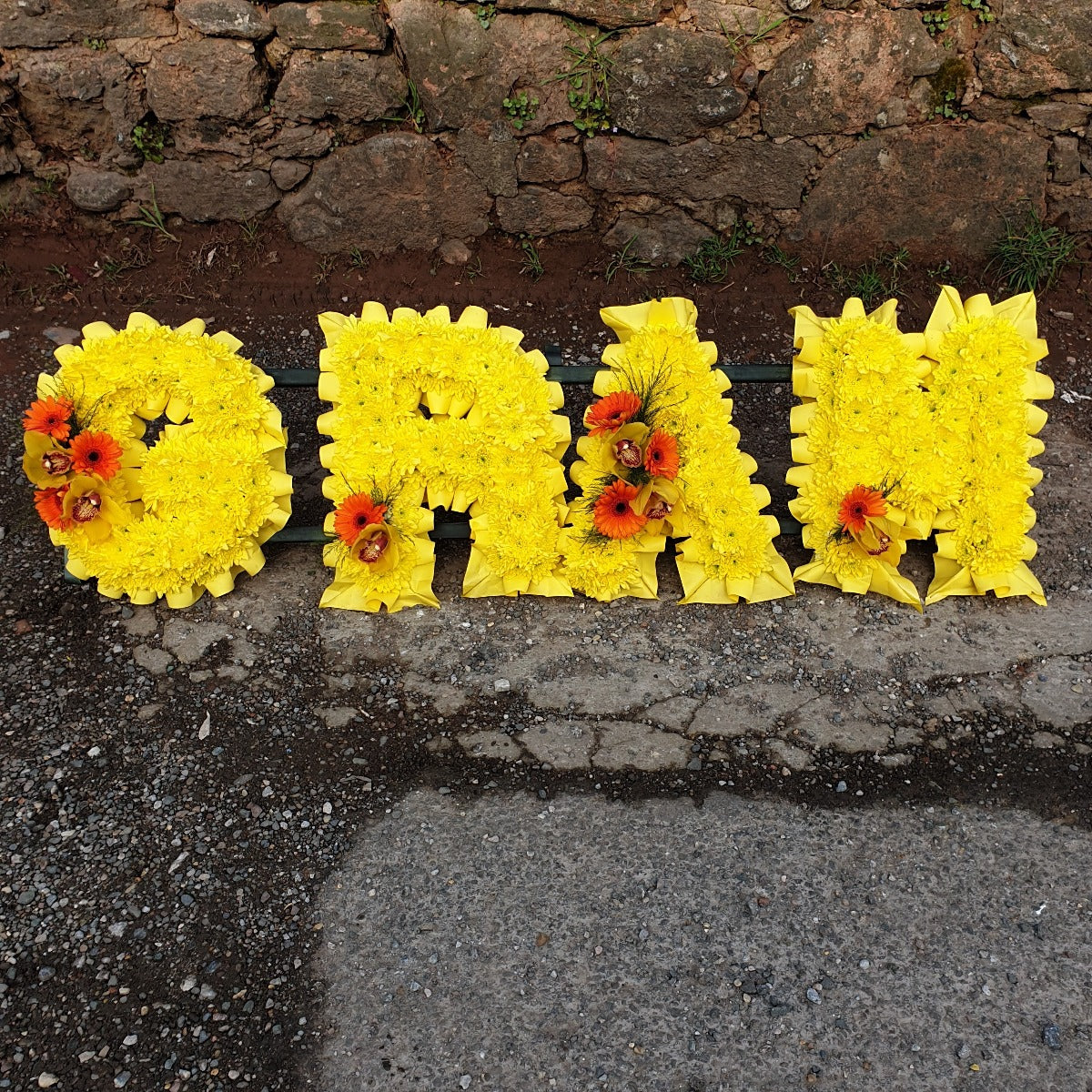 Yellow Gran Flower Tribute Funeral Tribute